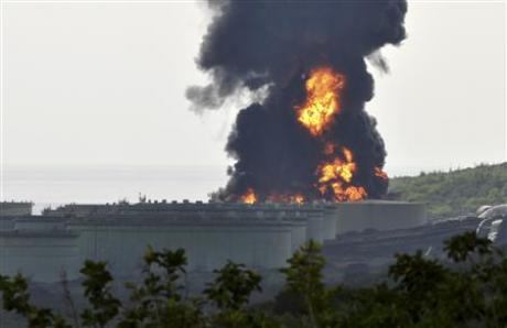 Smoke rises over Venezuela's PDVSA company oil storage terminal at Caribbean Island of Bonaire September 10, 2010. REUTERS/Stringer
