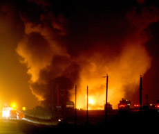 Flames and smoke rise above an oil pipeline fire that killed two workers near Clearbrook, Minn., on Wednesday.