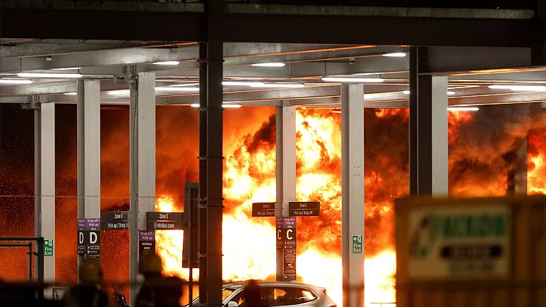 Flights suspended at London Luton airport after huge fire rips through car park