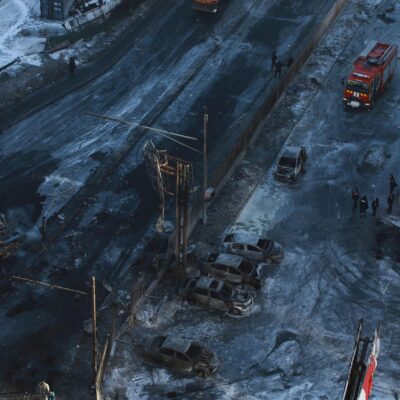 MONGOLIA-ACCIDENT Police officers inspect damage at the scene of an explosion from a vehicle crash in Ulaanbaatar, the capital of Mongolia on January 24, 2024. Six people were killed and 14 injured in a gas explosion caused by a vehicle crash in Mongolia's capital on January 24, authorities said. (Photo by BYAMBASUREN BYAMBA-OCHIR / AFP)