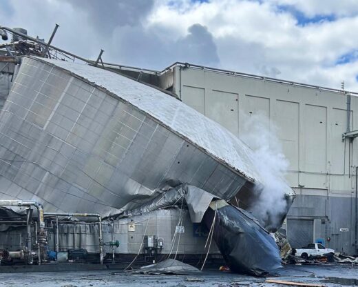 Washington State Chemical Plant Failure This photo provided by the City of Longview, Wash., shows structural damage to the Nippon Dynawave Packaging Co., after a tank containing hazardous liquid imploded, on Tuesday, May 26, 2026 in Longview, Wash. (City of Longview via AP)